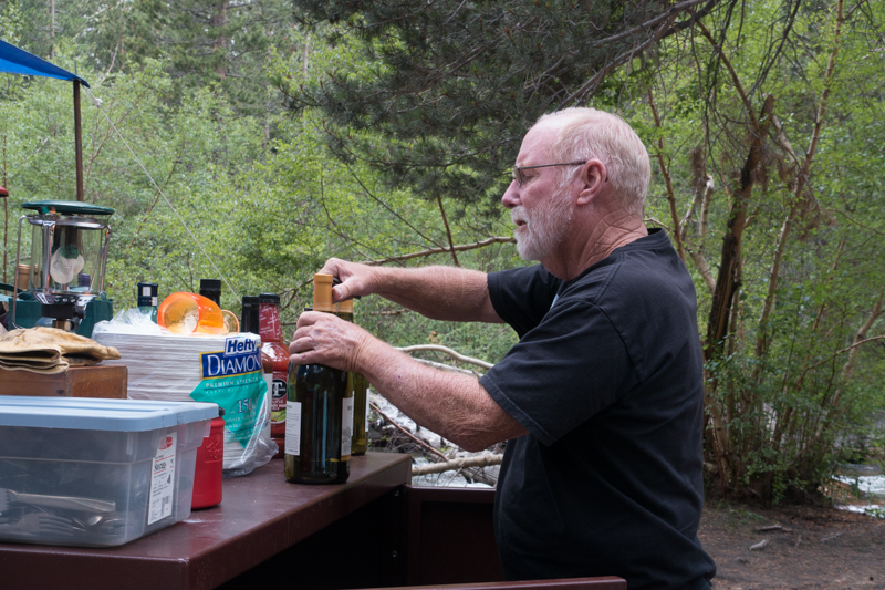Bill opening a wine bottle