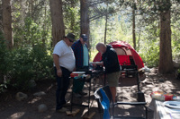 three men cooking