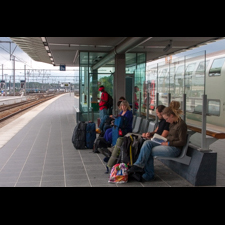 sitting at railroad platform